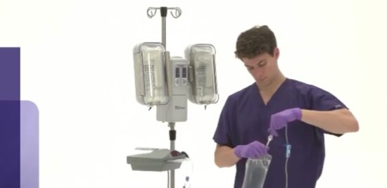 Nurse setting up a 3M™ Ranger™ Warming System.
