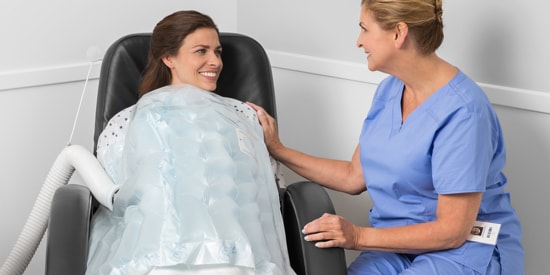 Clinician talking to female patient
